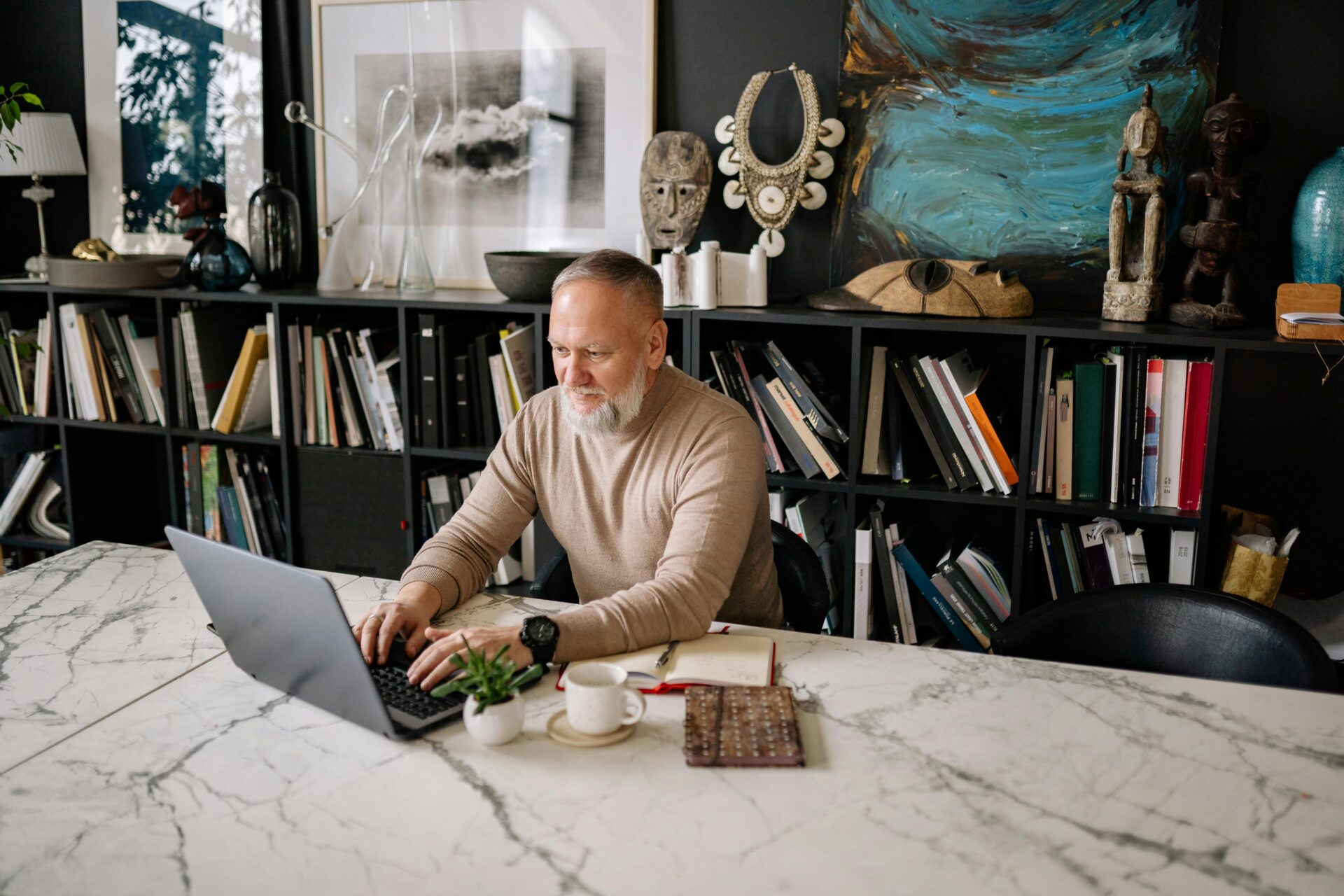 older man working from his home office