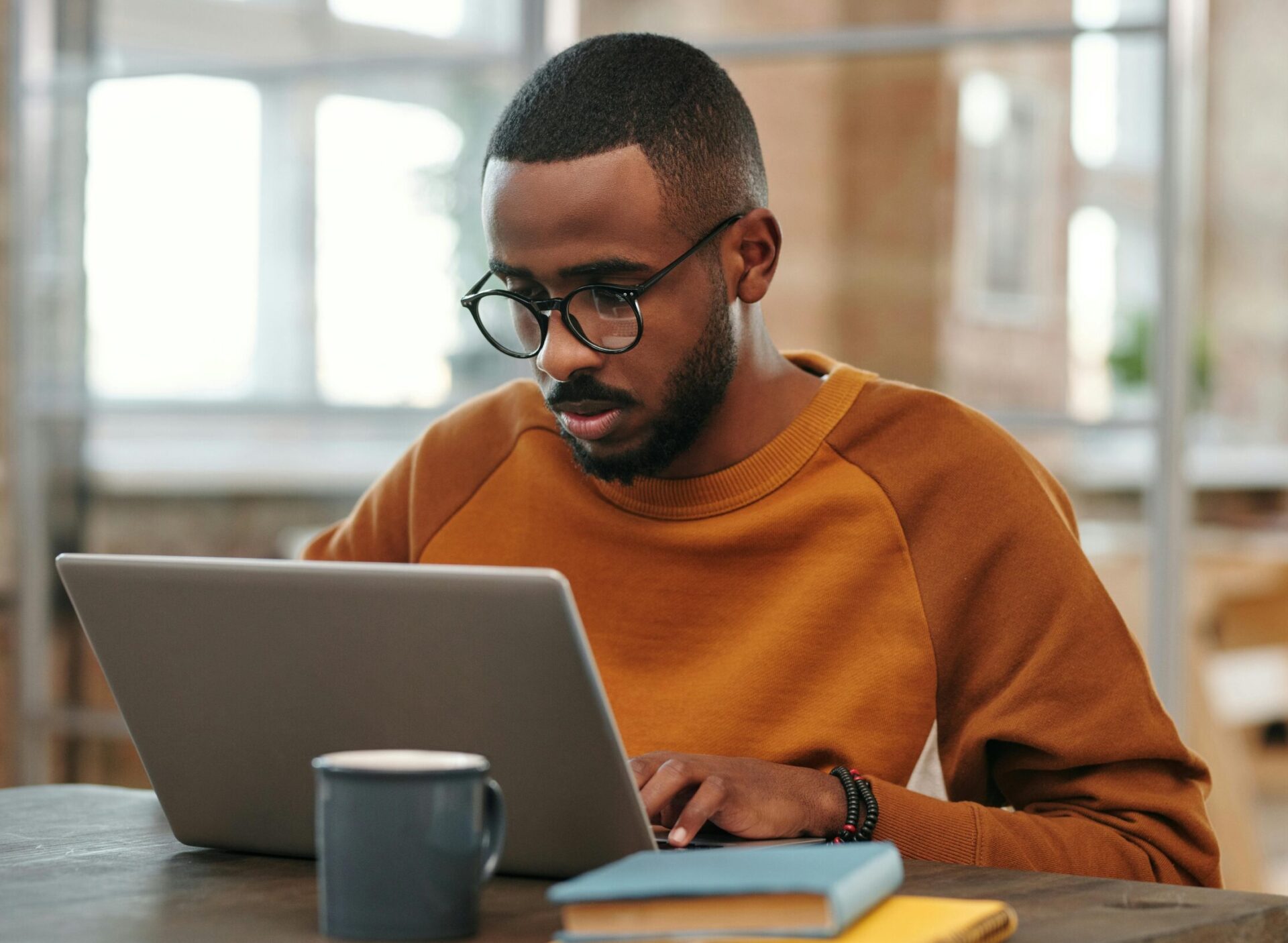 Young African American man working from his laptop
