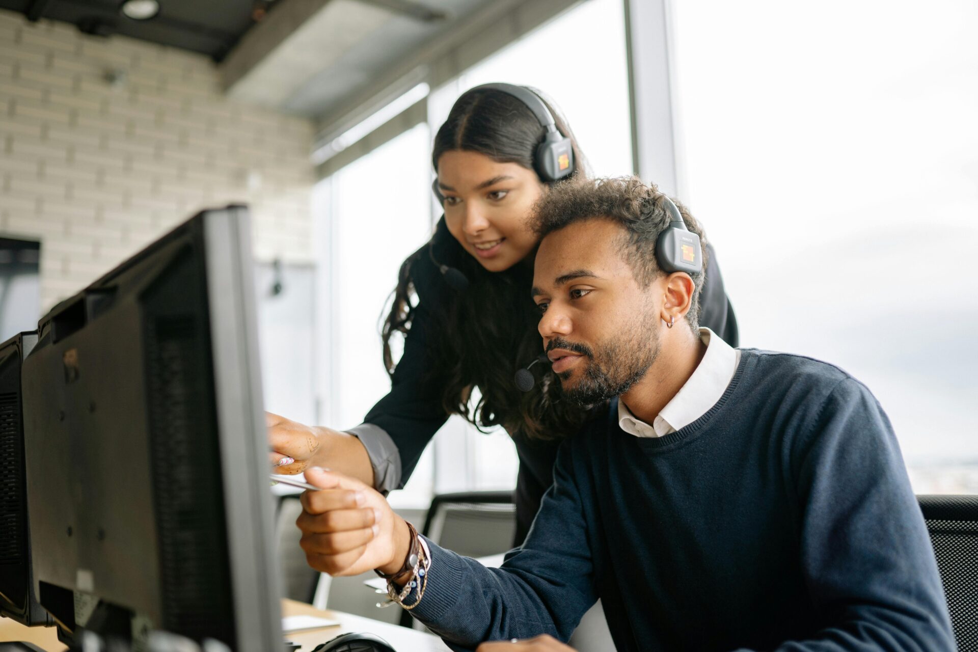 Two young coworkers going over reports together