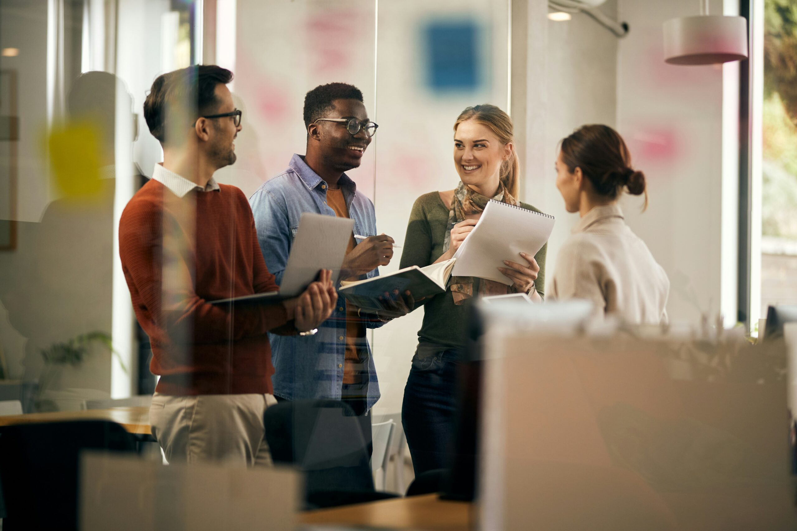 Group of coworkers laughing at work